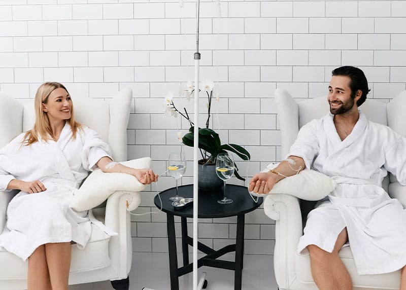 Couple in Fort Myers receiving IV therapy at NewU Wellness.